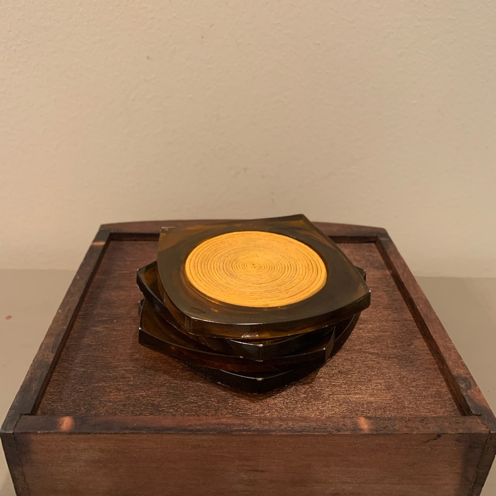 Four brown lucite tortoise coasters